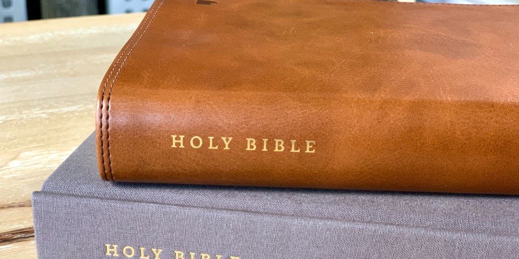 bibles-stacked-on-table-1024x576